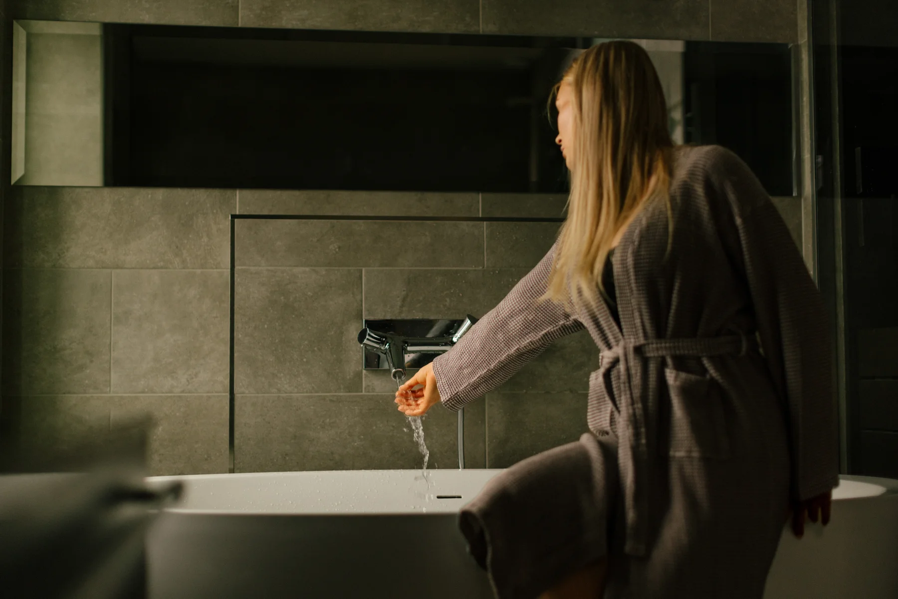 Woman running a bath