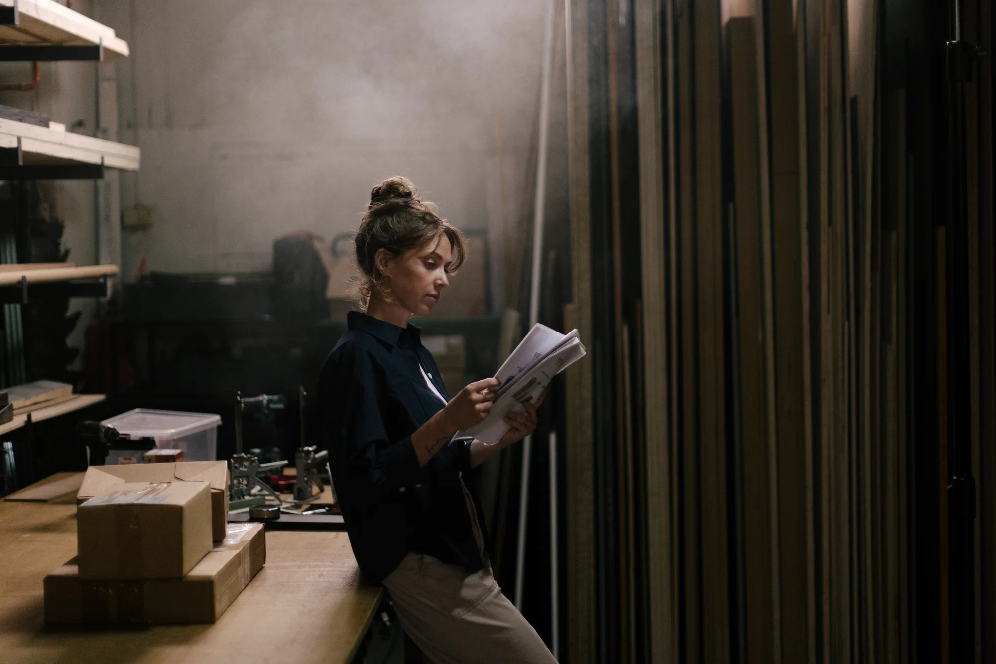 Woman reading in a workshop